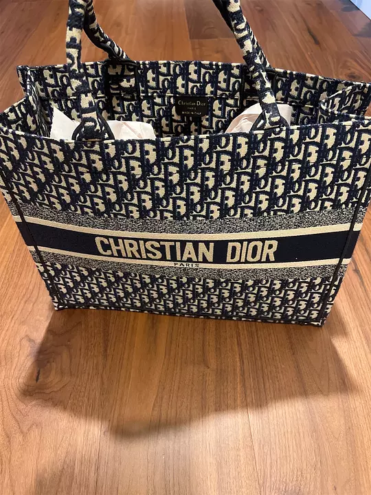 Cartera christian dior precio original new arrivals